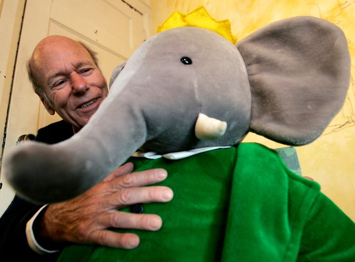 Babar author Laurent de Brunhoff poses for a photograph with Babar while celebrating 75 years of the book on Friday, April 21, 2006 at Mabel's Fables in Toronto, Ontario, Canada.