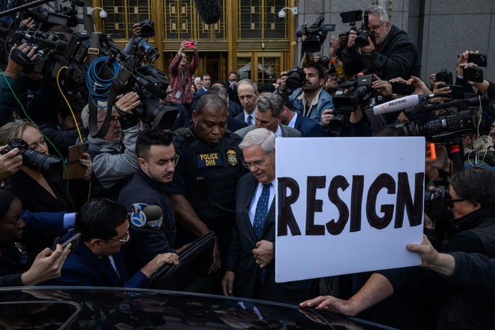 Sen. Bob Menendez (D-N.J.), center, departs federal court on Sept. 27. His indictment on bribery charges has made corruption a theme in the race to succeed him.