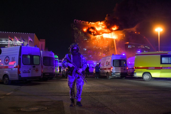 A Russian Rosguardia (National Guard) soldier secures an area amid a fire at the Crocus City Hall on the western edge of Moscow on Friday.