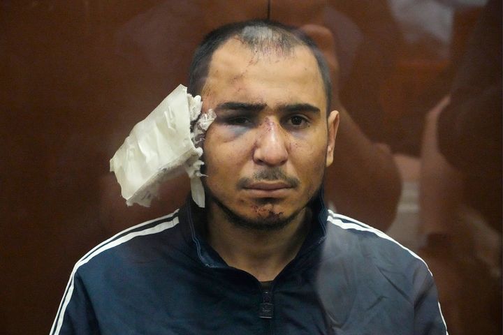 Saidakrami Murodali Rachabalizoda, a suspect in the Crocus City Hall shooting, sits in a glass cage in the Basmanny District Court in Moscow on Sunday.