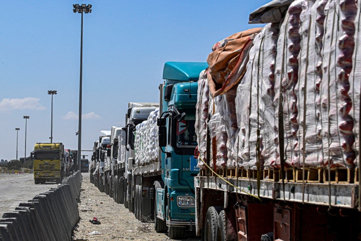 Egyptian trucks carrying humanitarian aid bound for the Gaza Strip outside the Rafah border on March 23, amid the ongoing conflict in the Palestinian territory between Israel and the Palestinian militant group Hamas.