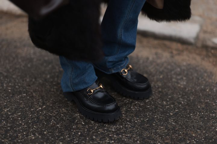 Gucci black loafer with golden details spotted in Berlin, Germany. 