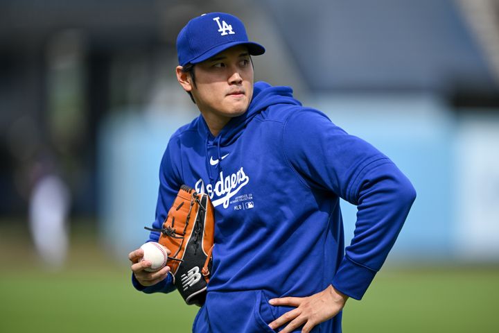 Shohei Ohtani warms up after addressing allegations against his ex-interpreter during a press conference at Dodger Stadium on Mar. 25, 2024.