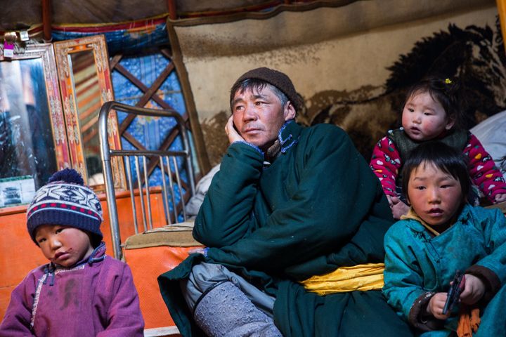 Davaadorj Duuji sits with his family in his home in a dzud-affected area in Darkhad Valley, Khovsgol province, Mongolia.