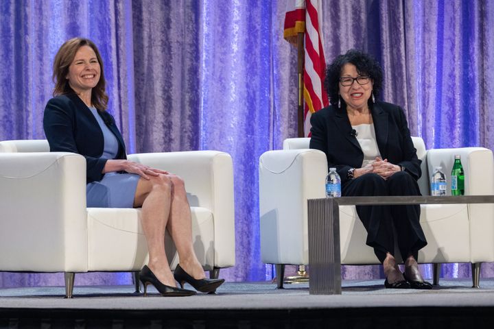 Supreme Court Justices Amy Coney Barrett and Sonia Sotomayor participate in a discussion on Feb. 23 on how to "Disagree Better," moderated by Thomas Griffith, a retired judge on the U.S. Court of Appeals for the District of Columbia Circuit, at the National Governors Association Winter Meeting in Washington.