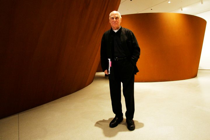 Famed American sculptor Richard Serra poses for a portrait next to "Sequence" during the press preview of "Richard Serra Sculpture: Forty Years" at the Museum of Modern Art, May 29, 2007, in New York. Serra, known for turning curving walls of rusting steel and other malleable materials into large-scale pieces of outdoor artwork that are now dotted across the world, died Tuesday, March 26, 2024, at his home in Long Island, N.Y. He was 85.