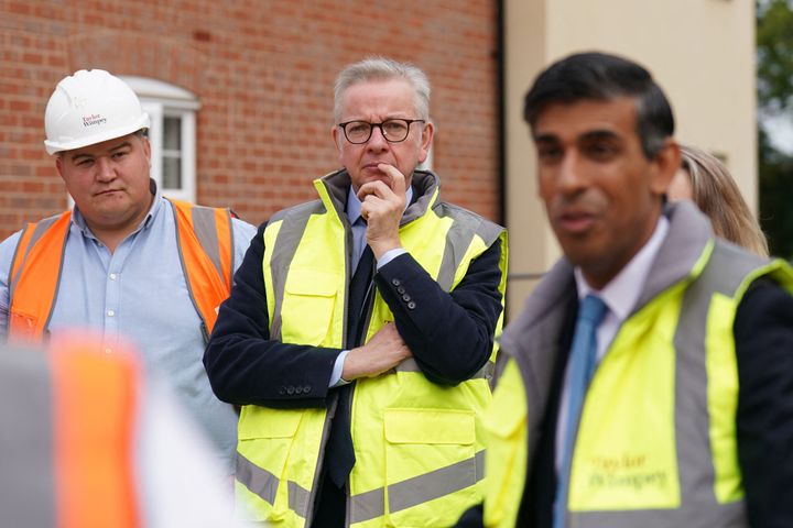 Britain's Levelling Up, Communities and Housing Secretary Michael Gove (C) and Britain's Prime Minister Rishi Sunak (R) visits the Taylor Wimpey Heather Gardens housing development in Norwich on August 29, 2023. (Photo by Joe Giddens / POOL / AFP) (Photo by JOE GIDDENS/POOL/AFP via Getty Images)