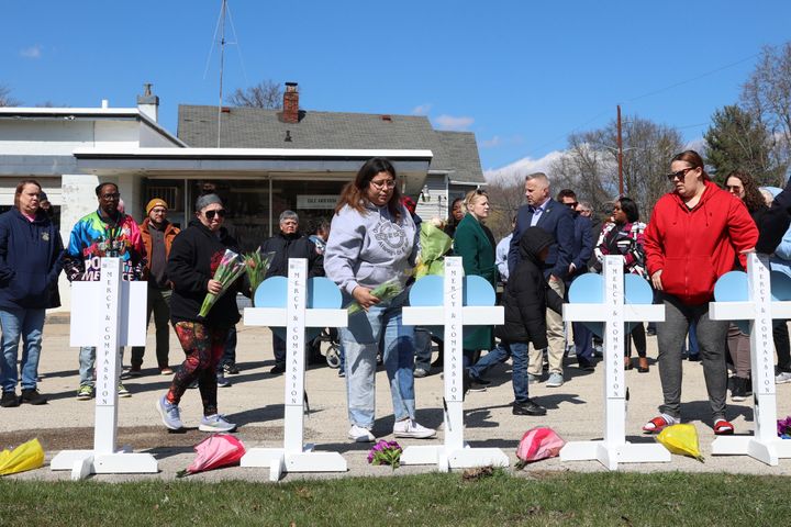 Community members gather at a vigil to remember victims of a recent deadly stabbing attack on March 28, 2024, in Rockford, Illinois. Four people were killed and seven others injured, including a US postal worker.