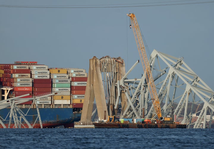 BALTIMORE, MARYLAND - MARCH 29: A crane works on the debris of the Francis Scott Key Bridge on March 29, 2024 in Baltimore, Maryland. (Photo by Kevin Dietsch/Getty Images)