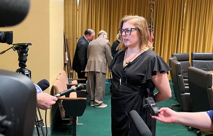 Nebraska state Sen. Machaela Cavanaugh (D) speaks to reporters following a hearing on her motion to censure state Sen. Steve Halloran (R). 