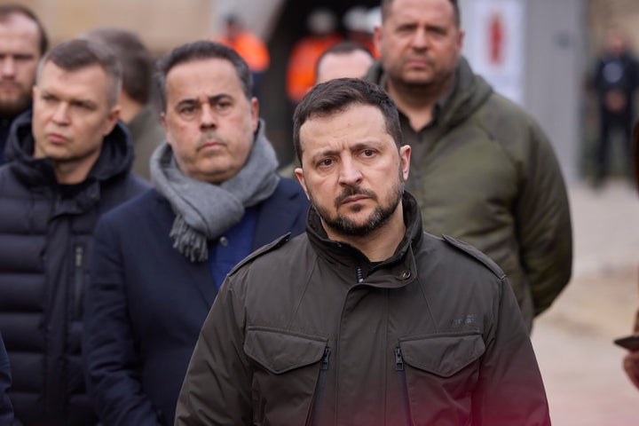 In this photo provided by the Ukrainian Presidential Press Office, Ukrainian President Volodymyr Zelenskyy reacts during his visit a place of Russian attack at a residential area on March 2, with Greece's Prime Minister Kyriakos Mitsotakis, not in the picture, in Odesa, Ukraine, Wednesday, March 6, 2024. (Ukrainian Presidential Press Office via AP)