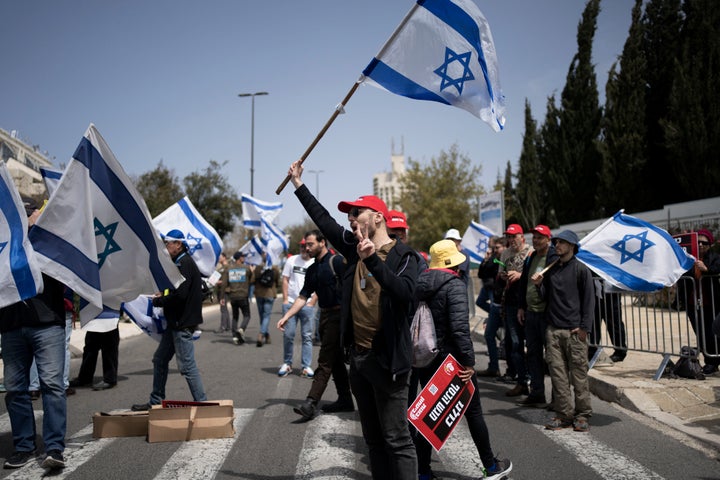 FILE - Members of Brothers and Sisters in Arms and Bonot Alternativa (Women Building an Alternative) protest Israel's exemptions for ultra-Orthodox Jews from mandatory military service, near the Prime Minister's office in Jerusalem, on March 26, 2024. Israel's High Court ruling Thursday to curtail subsidies for ultra-Orthodox men has thrown Prime Minister Benjamin Netanyahu's political future into grave jeopardy. Netanyahu now has until Monday to present the court with a plan to dismantle what the justices called a system that privileges the ultra-Orthodox at the expense of the country's majority. (AP Photo/Maya Alleruzzo, File)