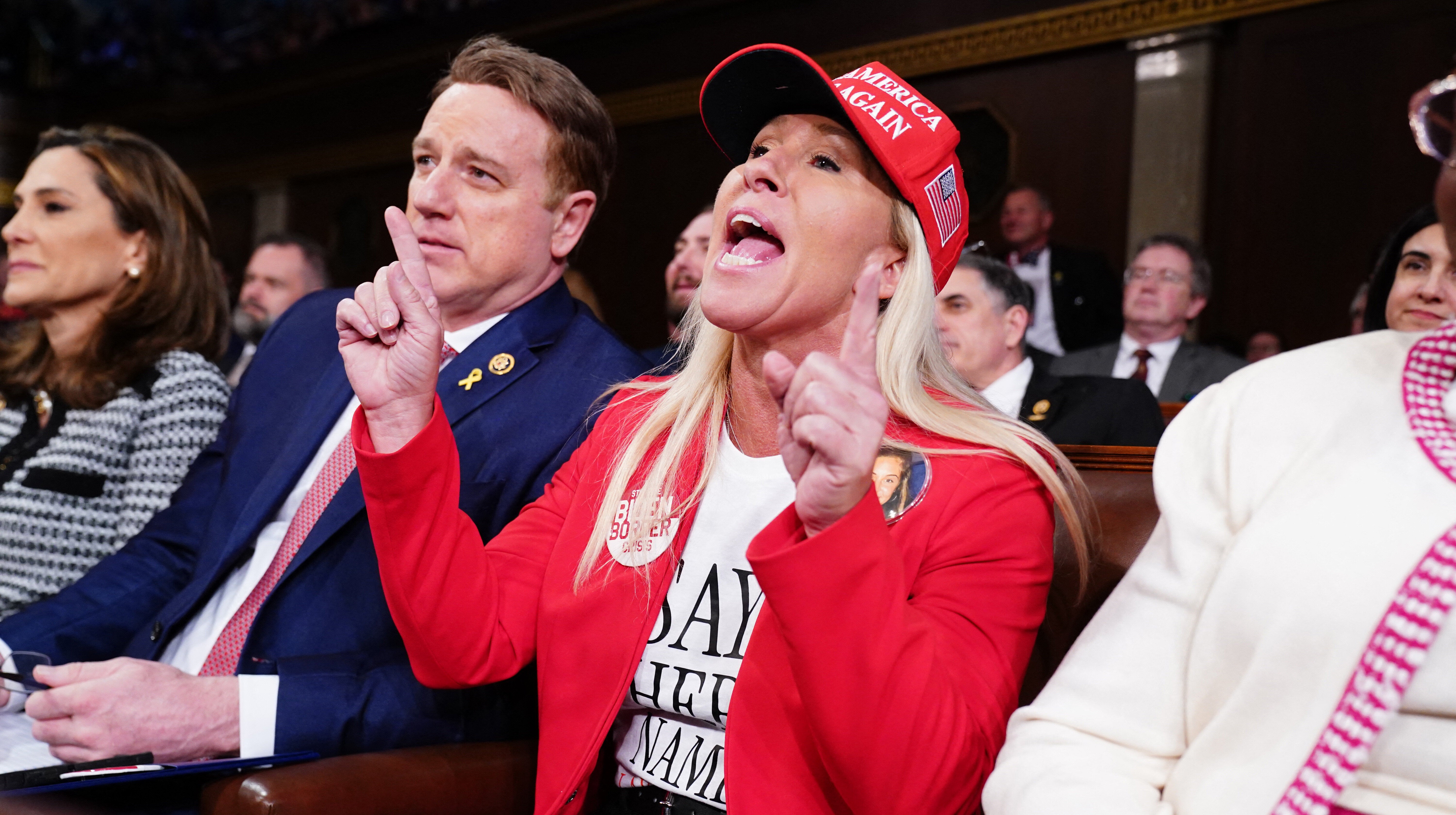 Republican Representative from Georgia Marjorie Taylor Greene shouts at US President Joe Biden as he delivers his third State of the Union address.