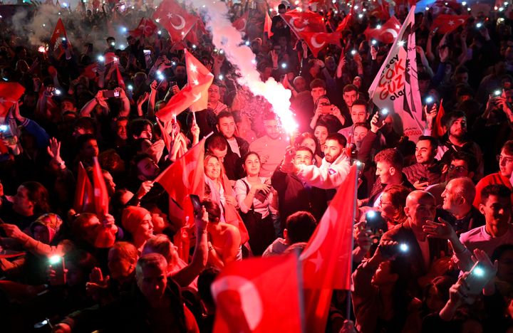 Opposition Republican People's Party (CHP) supporters celebrate outside the main municipality building following municipal elections across Turkey, in Istanbul on March 31, 2024. Turkey's main opposition party on March 31 claimed victory in Istanbul and Ankara, with its rising political star emerging from local elections as a serious challenger to veteran President Recep Tayyip Erdogan.Erdogan, addressing supporters at his party's headquarters in Ankara, acknowledged a "turning point" for his party and promised to respect the results.Partial results from across the nation of 85 million people showed major advances for the Republican People's Party (CHP) at the expense of Erdogan's Justice and Development Party (AKP) that has dominated politics for more than two decades. (Photo by YASIN AKGUL / AFP) (Photo by YASIN AKGUL/AFP via Getty Images)