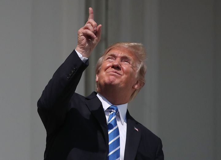 The last total solar eclipse over the U.S. was in 2017. Then-President Donald Trump was photographed looking up at the sky towards it at the White House, both while wearing protective glasses and without, which is not advised. 