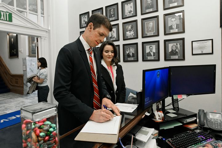 Sam Brown, Republican candidate for Senate in Nevada, submits the paperwork for his bid as his wife Amy looks on. Amy revealed that she had an abortion in an interview in February.