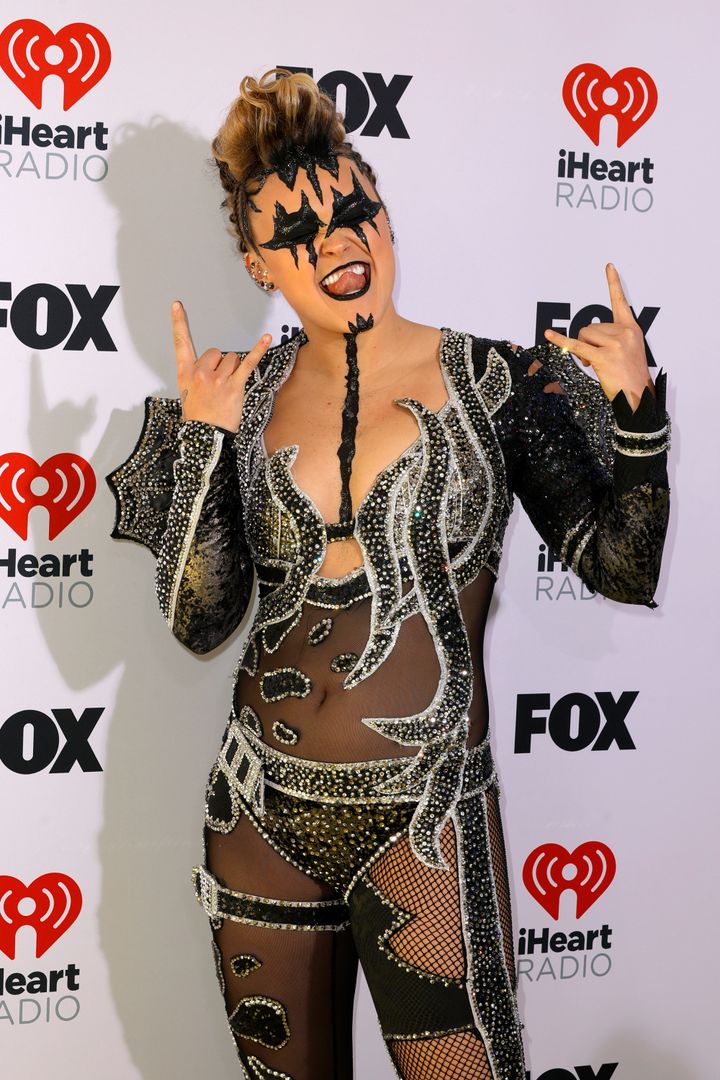 JoJo Siwa wore an outrageous rhinestone bodysuit and black face paint to the 2024 iHeartRadio Music Awards on Monday.
