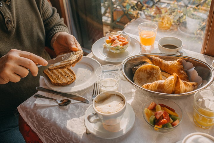 Man having continental breakfast.