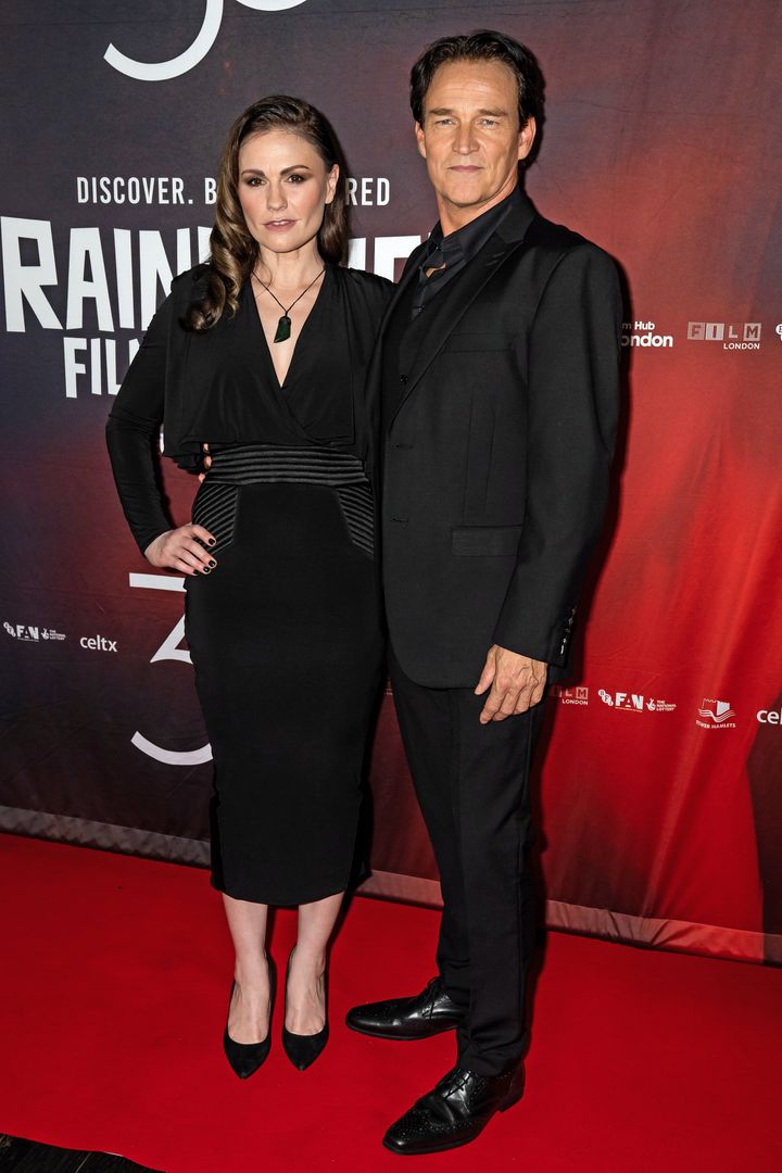 Paquin and Moyer at the world premiere of "A Bit of Light" at the Raindance Film Festival in London on Oct. 29, 2022. The two, who are married, worked together on the indie drama.