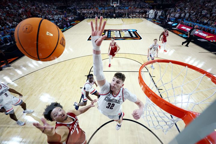 GLENDALE, ARIZONA - APRIL 06: (EDITORS NOTE: Image taken using a remote camera.) Donovan Clingan #32 of the Connecticut Huskies blocks the ball during the second half in the NCAA Men’s Basketball Tournament Final Four semifinal game against the Alabama Crimson Tide at State Farm Stadium on April 06, 2024 in Glendale, Arizona. (Photo by Brett Wilhelm/NCAA Photos via Getty Images)
