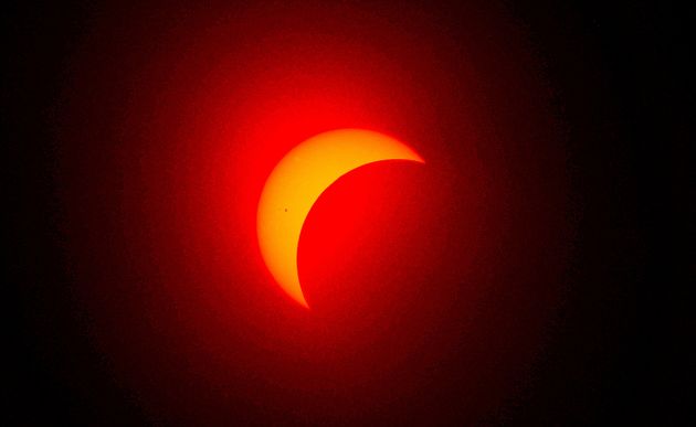 FORT WORTH, TEXAS - APRIL 8: The moon eclipses the sun on April 8, 2024 in Fort Worth, Texas. Millions of people have flocked to areas across North America that are in the 