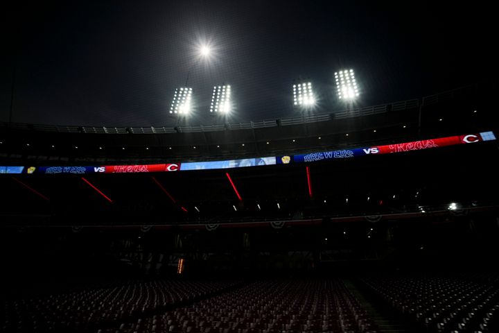 A general view of the stands in Great American Ball Park during a total solar eclipse before a baseball game between the Milwaukee Brewers and the Cincinnati Reds in Cincinnati, Monday, April 8, 2024. (AP Photo/Aaron Doster)