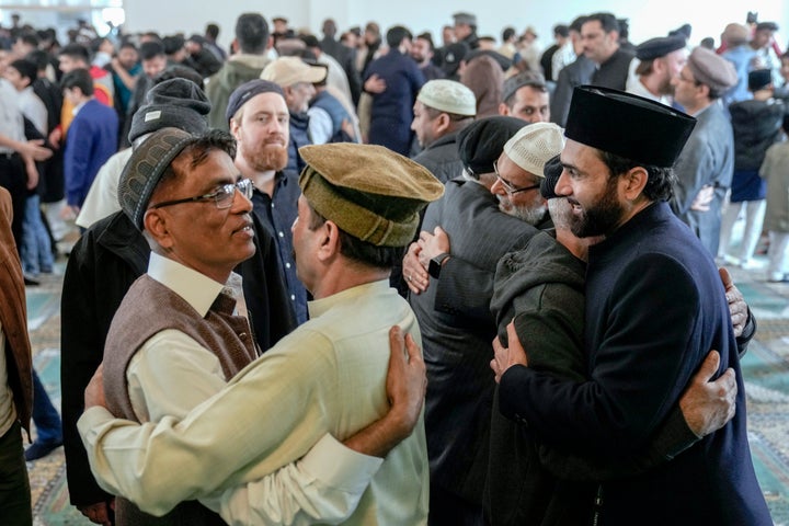 Muslims congratulate each other on Eid al-Fitr by hugging after the prayer, marking the end of the fasting month of Ramadan, in Berlin, Germany, on Wednesday, April, 10, 2024.