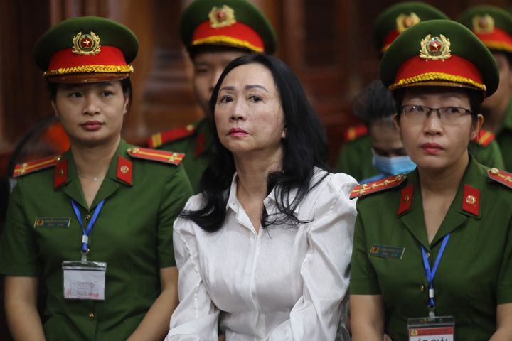TOPSHOT - Vietnamese property tycoon Truong My Lan (C) looks on at a court in Ho Chi Minh city on April 11, 2024. A top Vietnamese property tycoon could face the death penalty when she and dozens of other co-accused face verdicts on April 11 in one of the country's biggest fraud cases over the embezzlement of USD 12.5 billion. (Photo by AFP) (Photo by STR/AFP via Getty Images)