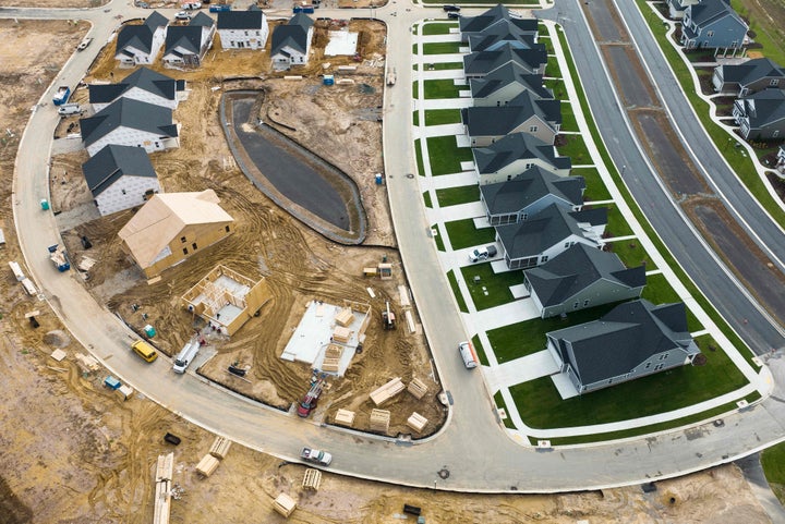 In this aerial view, completed and under construction new homes at a site in Trappe, Maryland, on October 28, 2022. 