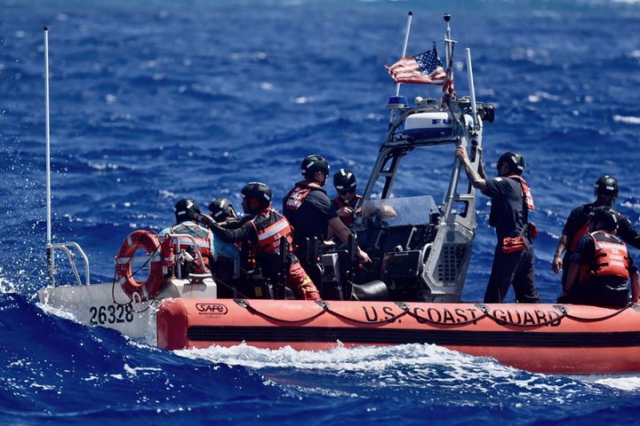 This photo provided by the U.S. Coast Guard, the crew of USCGC Oliver Henry (WPC 1140), rescues three mariners that were stranded on Pikelot Atoll, Yap State, Federated States of Micronesia, on April 9, 2024. The stranded mariners spelled out âHELPâ with palm fronds on a beach that were spotted by Coast Guard and Navy aviators, the sign pinpointed them in a search area spanning thousands of square miles. (U.S. Coast Guard photo)