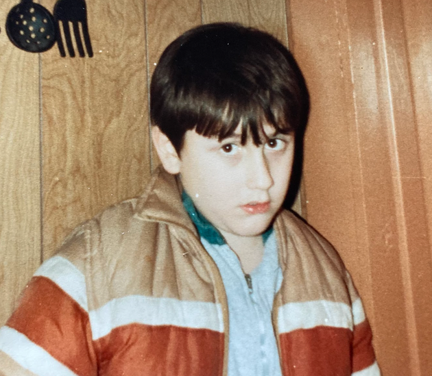 The author is pictured in elementary school, around the time he was singled out by a teacher for his tics.