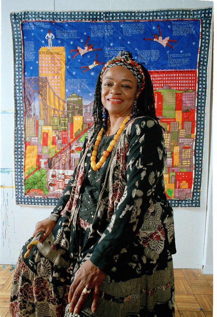 FILE - Artist Faith Ringgold sits before her quilt called "Tar Beach" in her New York City studio on July 23, 1993. "Tar Beach" is also the title of an autobiographical children's book by Ringgold and an exhibition based on the book at the Children's Museum. Ringgold died Friday, April 12, 2024, at her home in Englewood, N.J. She was 93. (AP Photo/Kathy Willens)