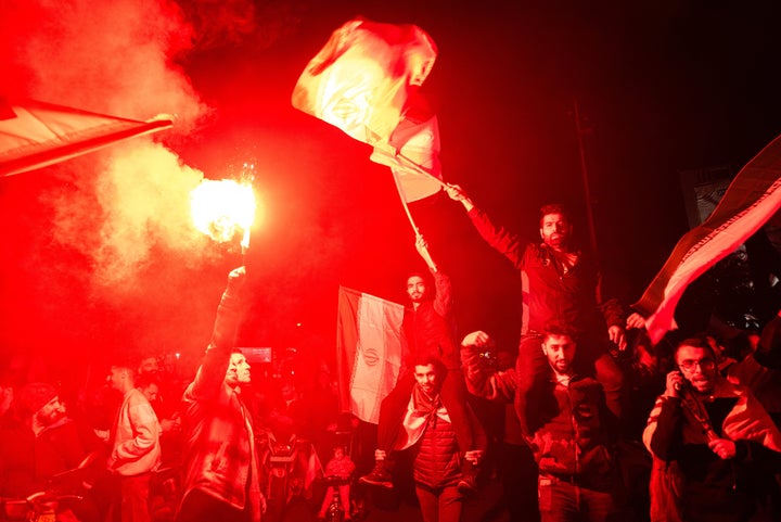 Iranian pro-government supporters gather at Palestine Square in Tehran, on April 14, 2024, in a celebration of the early morning Iran's IRGC attack on Israel. (Photo by Hossein Beris / Middle East Images / Middle East Images via AFP)