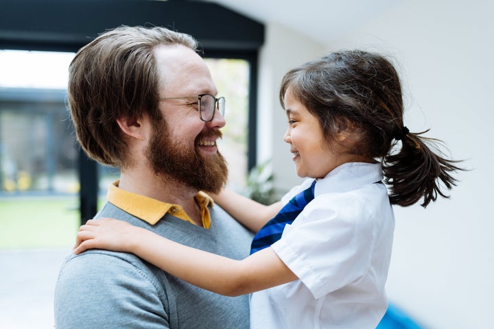 Series of images of real multi generation British Asian mixed family with three kids at home