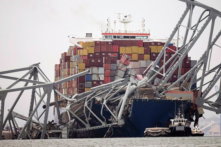 A cargo ship is seen stuck under pieces of the Francis Scott Key Bridge after its collision on March 26. 