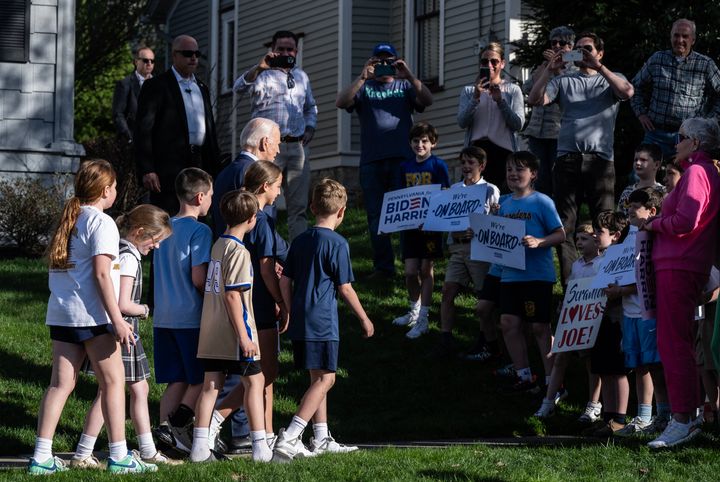 US President Joe Biden walks with children in front of his childhood home in Scranton, Pennsylvania, on April 16, 2024. Joe Biden made a campaign trip to his beloved birthplace Tuesday in Scranton, Pennsylvania, where he unleashed a blistering condemnation of Donald Trump as the tycoon languished in court. (Photo by ANDREW CABALLERO-REYNOLDS / AFP) (Photo by ANDREW CABALLERO-REYNOLDS/AFP via Getty Images)