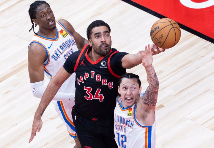 Jontay Porter, center, of the Toronto Raptors, fights for a rebound during a 2023-2024 NBA regular season game between Toronto Raptors and Oklahoma City Thunder in Toronto, Canada, March 22, 2024. (Photo by Zou Zheng/Xinhua via Getty Images)