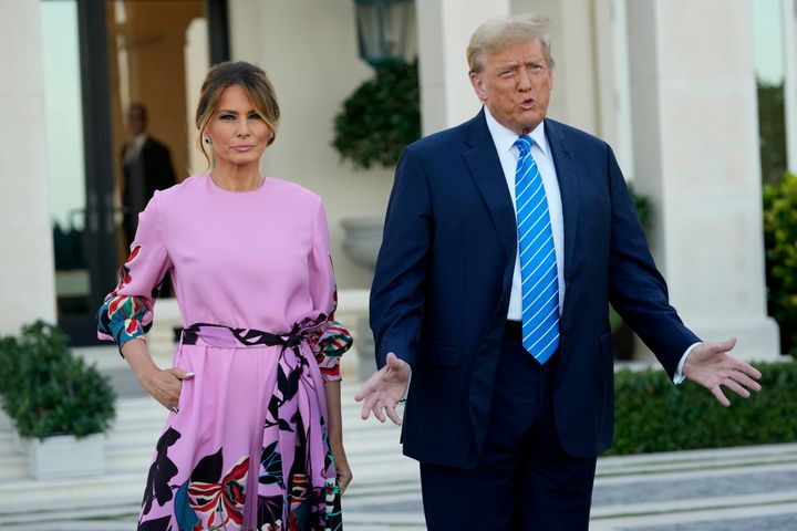 Former President Donald Trump, right, stands with his wife, Melania Trump, as they arrive for a GOP fundraiser Saturday, April 6, 2024, in Palm Beach, Florida.