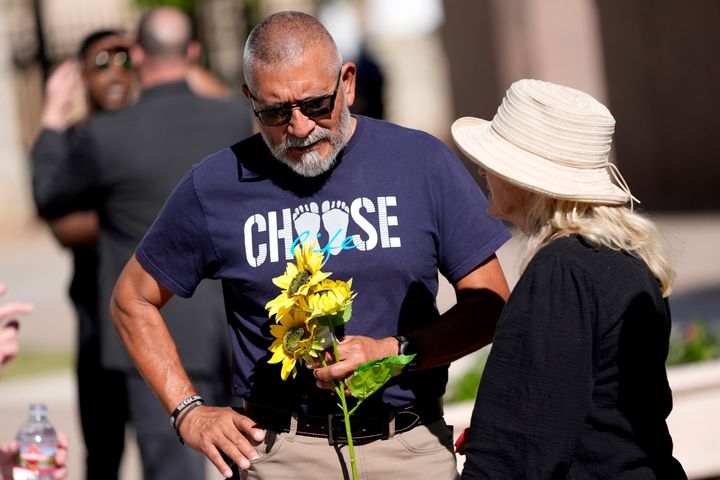 A anti-abortion supporter stands outside the House chamber, Wednesday, April 17, 2024, at the Capitol in Phoenix.