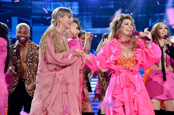 Taylor Swift, left, and Shania Twain on stage at the 2019 American Music Awards.