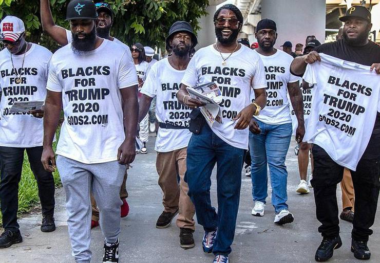Members of Blacks for Trump, led by Maurice Symonette (center), march at the Miami Federal Courthouse before an appearance by former President Donald Trump on June 13, 2023, in the classified documents case.
