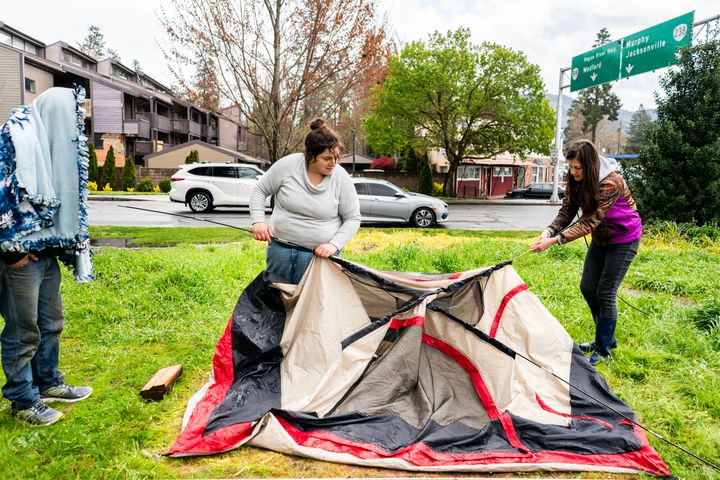 Jessica Meller (right), a registered nurse and advocate for homeless people, helps Samantha Crutcher move her campsite in Grants Pass, Oregon, after police threatened Samantha with a fine or jail.