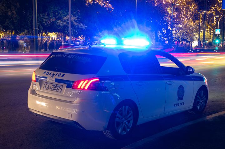 25 December 2023, Athens, Greece: This is a photo of a Greek police force car at night.