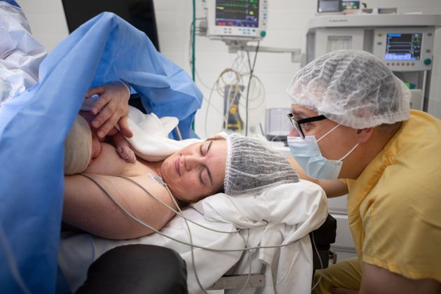 Mother feeds her newborn baby after a cesarean section - Doctors performing a cesarean section in the operating room - Buenos Aires - Argentina