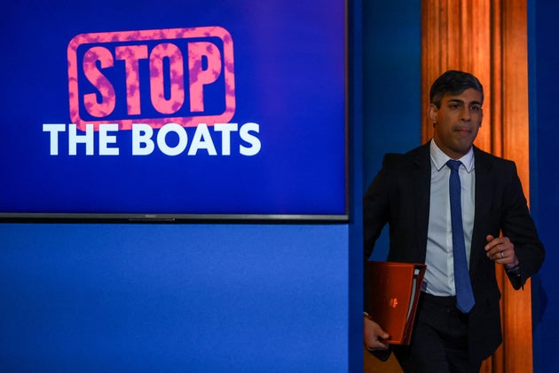 Rishi Sunak arrives to attend a press conference at Downing Street.