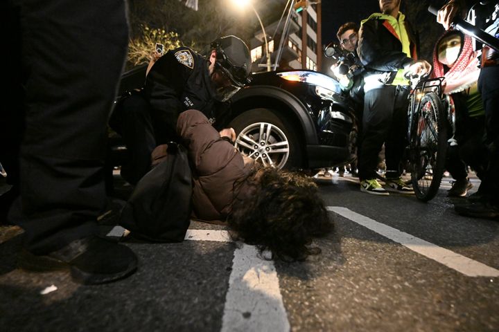 A person is seen being arrested during Monday night's protest in Manhattan.