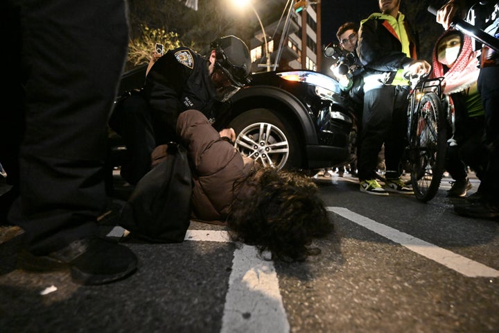 A person is seen being arrested during Monday night's protest in Manhattan.