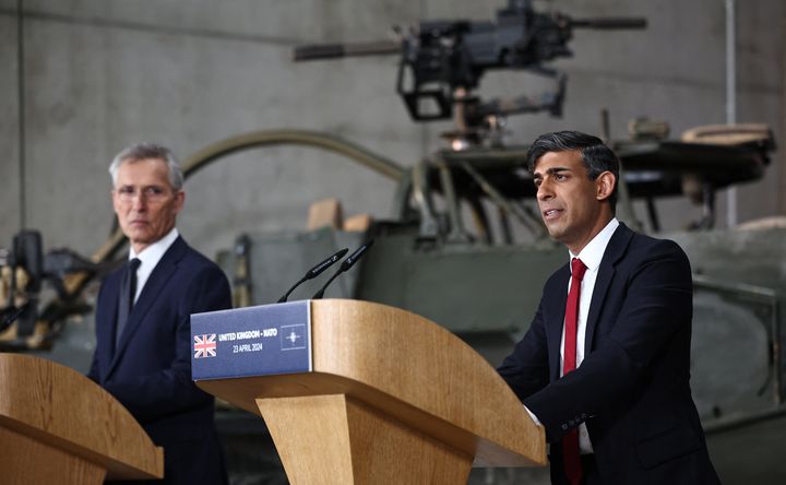 NATO Secretary General Jens Stoltenberg (L) and Britain's Prime Minister Rishi Sunak address a press conference at the Warsaw Armoured Brigade in Warsaw, Poland, on April 23, 2024. The talks of Britain's Prime Minister Rishi Sunak with his Polish counterpart Donald Tusk and NATO Secretary General Jens Stoltenberg are expected to focus on Ukraine and wider European security. While in Poland's capital, the British Prime minister will announce £500 million ($617 million) in additional military funding for Kyiv in its more-than two-year battle against Russia's full-scale invasion, his Downing Street office said in a statement. (Photo by HENRY NICHOLLS / POOL / AFP) (Photo by HENRY NICHOLLS/POOL/AFP via Getty Images)
