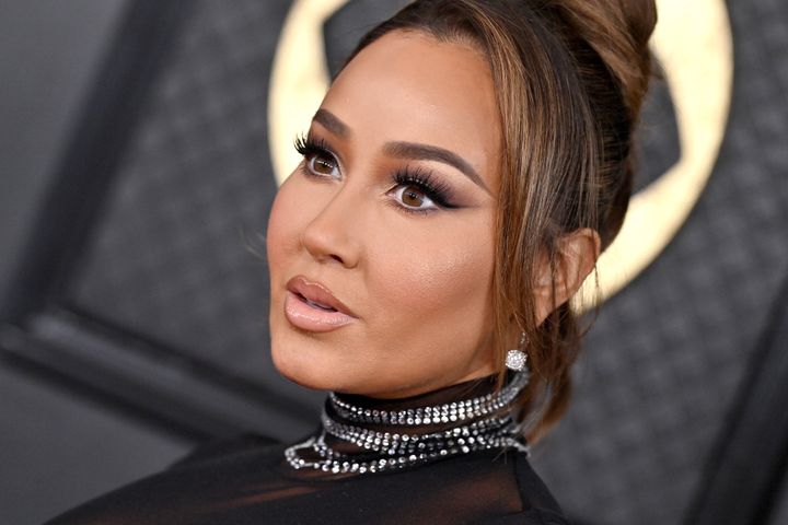 Adrienne Bailon-Houghton, seen here at the 2024 Grammy Awards, shared details of her fertility journey in an interview with People.