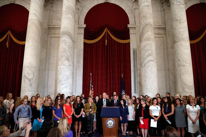 FILE - Sen. Jerry Moran, R-Kansas, center left, and Sen. Richard Blumenthal, D-Conn., attend a news conference with dozens of women and girls who were sexually abused by Larry Nassar, a former doctor for Michigan State University athletics and USA Gymnastics, on July 24, 2018, on Capitol Hill in Washington. (AP Photo/Jacquelyn Martin, File)